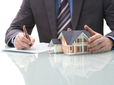Man signs purchase agreement for a house