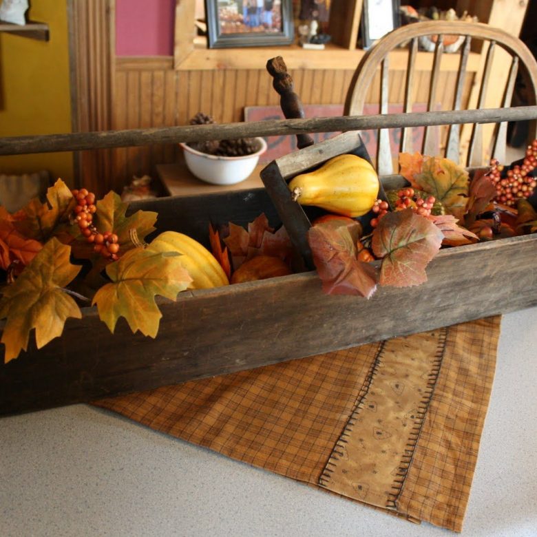 A wooden cutting board with a cake on a table